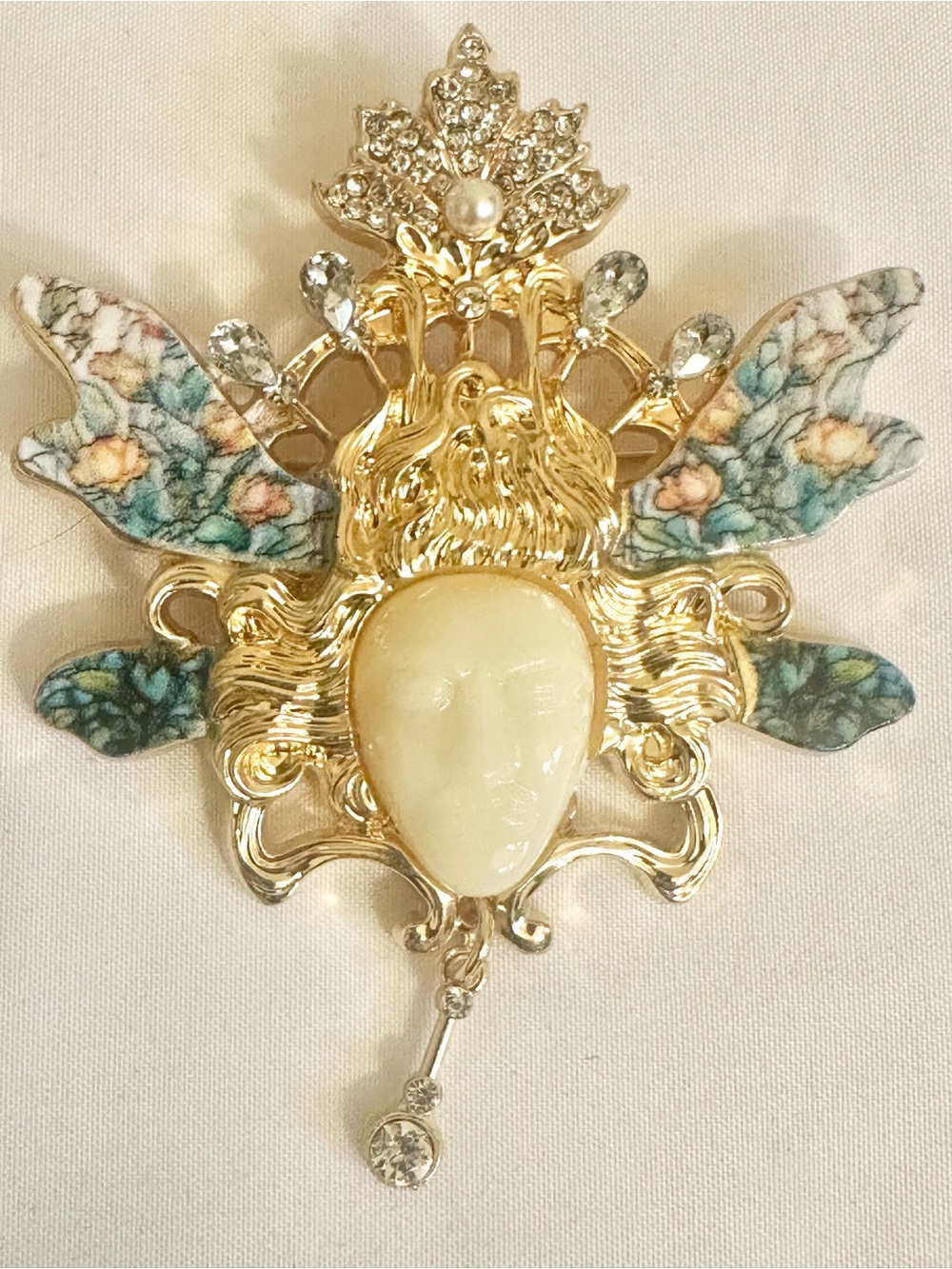 Gold Floral Winged Face Brooch in Cream and Blue-Green Accents